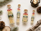 Rustic glass bottle with adventure wedding design and cork seal